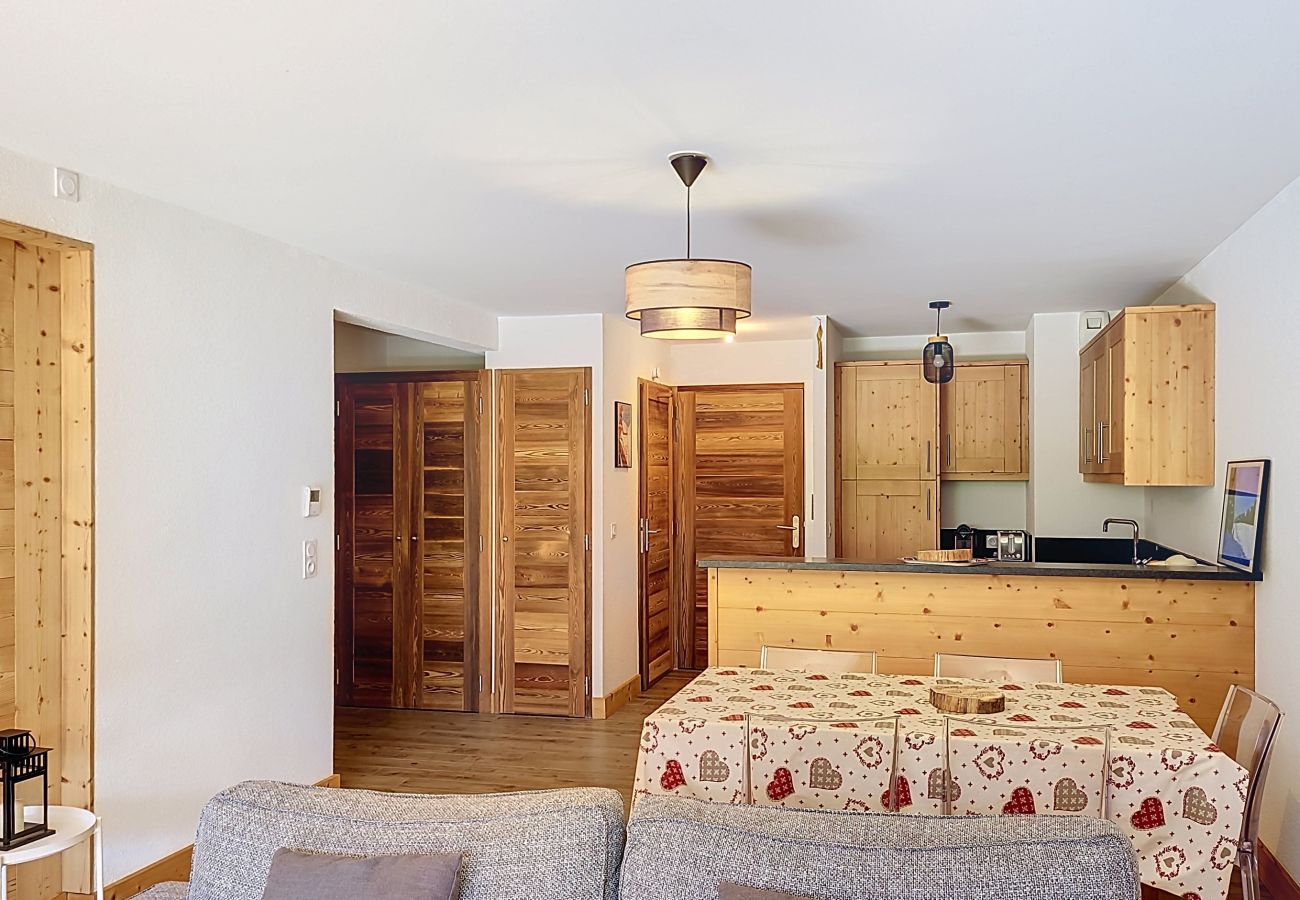 Living room, dining room, and open-plan kitchen.